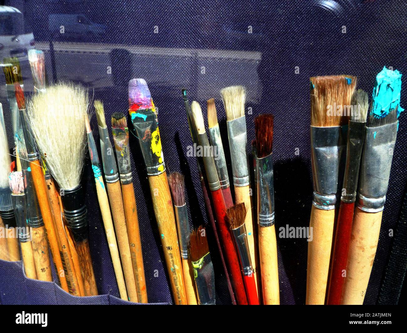 new and used dry colorful paint brushes in art supply store display ...