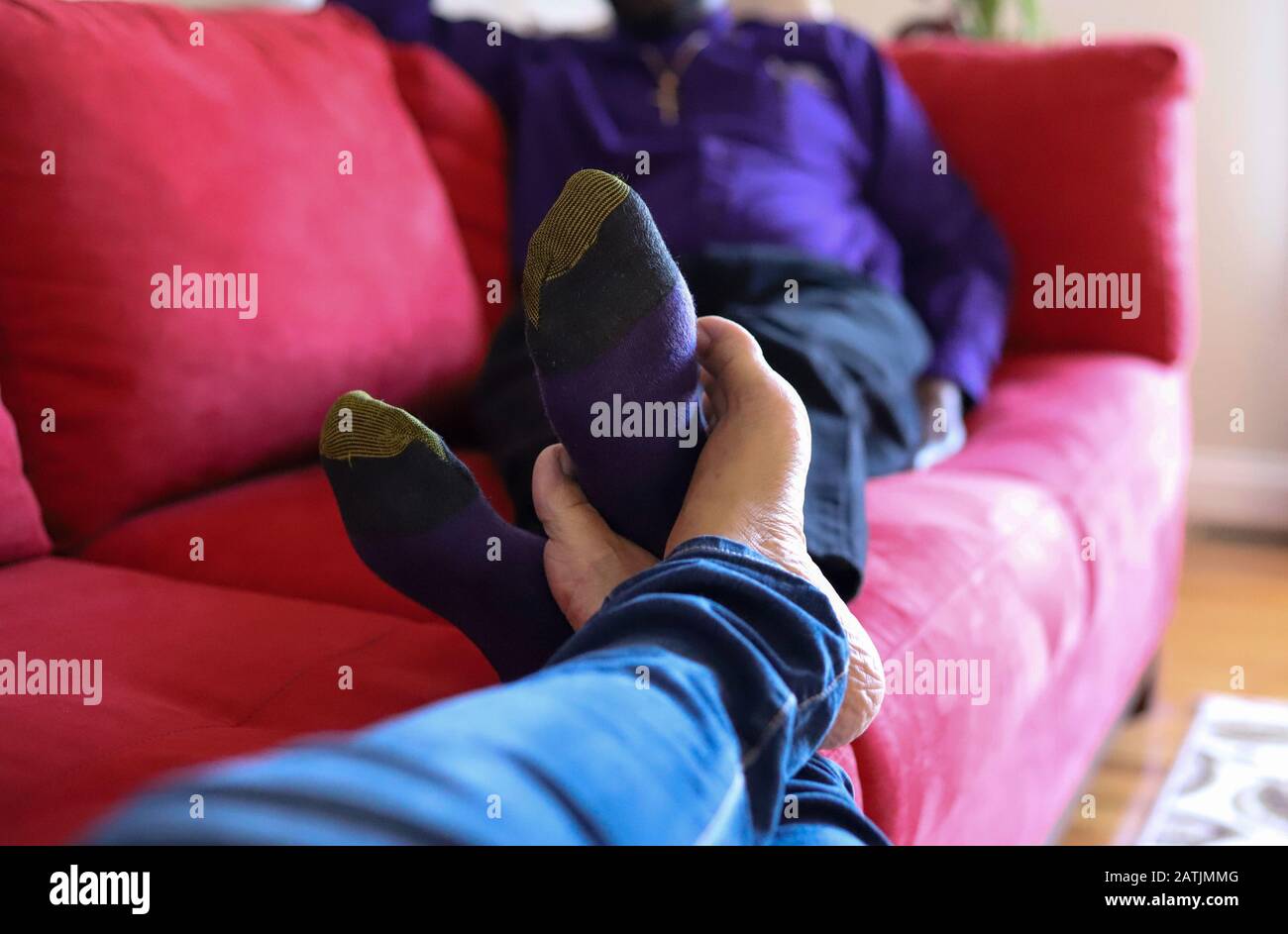 Barefoot girl lying on couch hi-res stock photography and images - Alamy