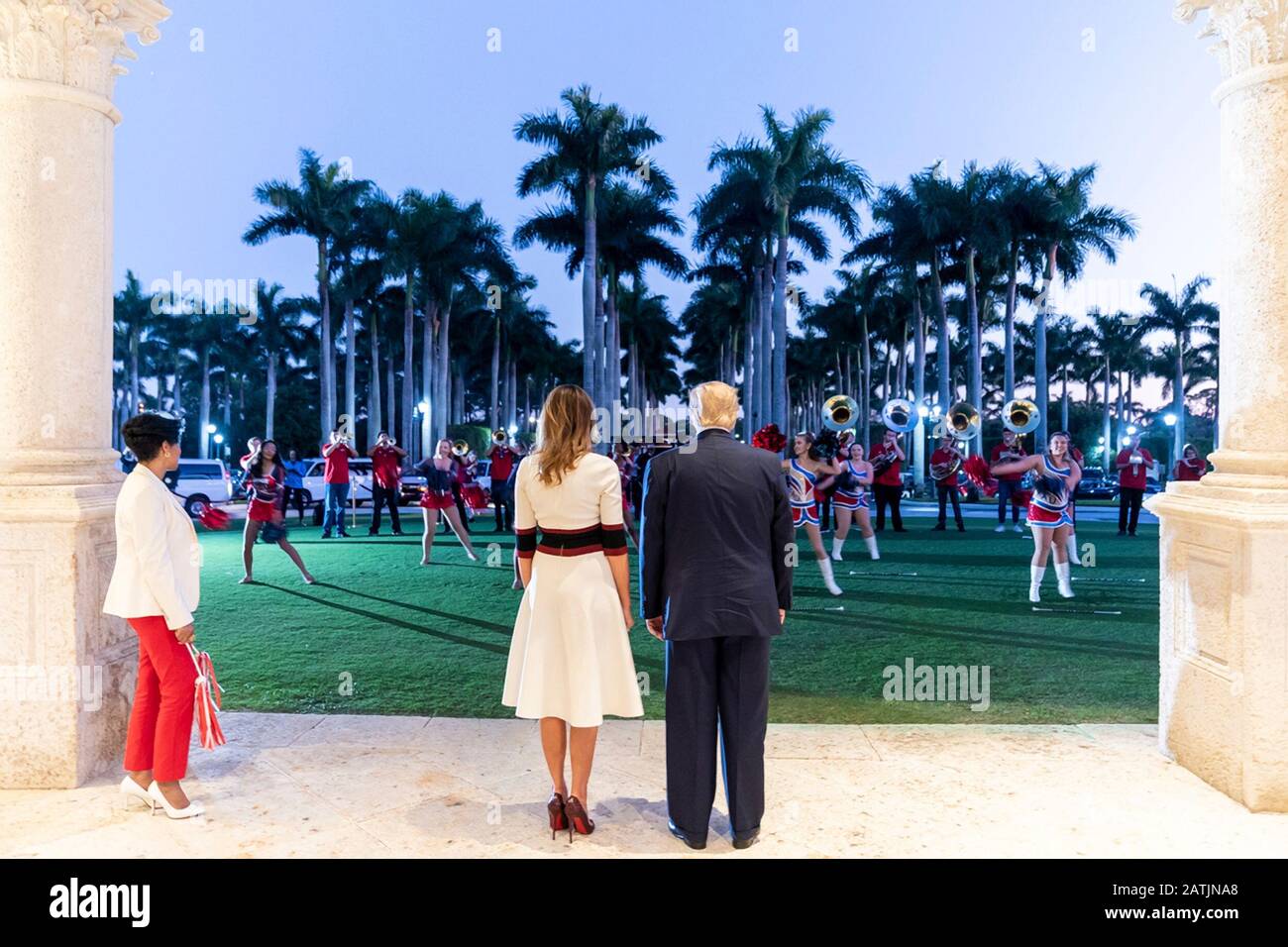 West Palm Beach, United States of America. 02 February, 2020. U.S President Donald Trump and First Lady Melania Trump are entertained by members of the Florida Atlantic University marching band prior to attending a Super Bowl party outside the Trump International Golf Club February 2, 2020 in West Palm Beach, Florida. Credit: Shealah Craighead/White House Photo/Alamy Live News Stock Photo