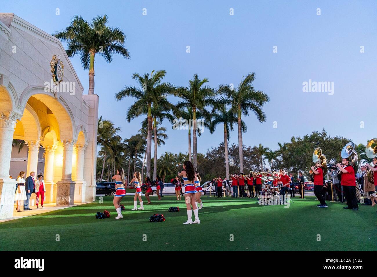 West Palm Beach, United States of America. 02 February, 2020. U.S President Donald Trump and First Lady Melania Trump are entertained by members of the Florida Atlantic University marching band prior to attending a Super Bowl party outside the Trump International Golf Club February 2, 2020 in West Palm Beach, Florida. Credit: Shealah Craighead/White House Photo/Alamy Live News Stock Photo