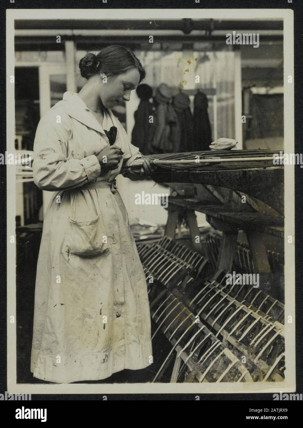 Womens Work Description: Airplane factory near Birmingham. British airplane women workers in the Midlands. Card splicing joints on frame or planes Annotation: Women's Work. Workers at an aircraft factory in Birmingham in the Midlands Date: {1914-1918} Location: Birmingham, UK Keywords: WWI, war industry, aircraft manufacturers, female labor Stock Photo