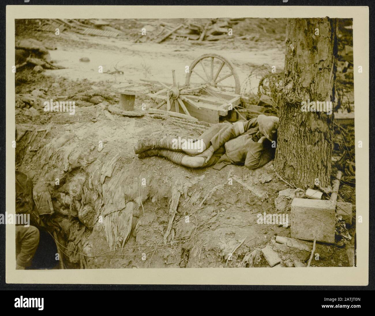 The British Western Front. Battle of Flanders Description: A tired out Tommy has a rest by the roadside. Annotation: The British Western Front. The battle of Flanders. An exhausted British soldier resting at the side of the road. Date: {1914-1918} Location: Belgium Keywords: WWI, fronts, soldiers, equip Stock Photo