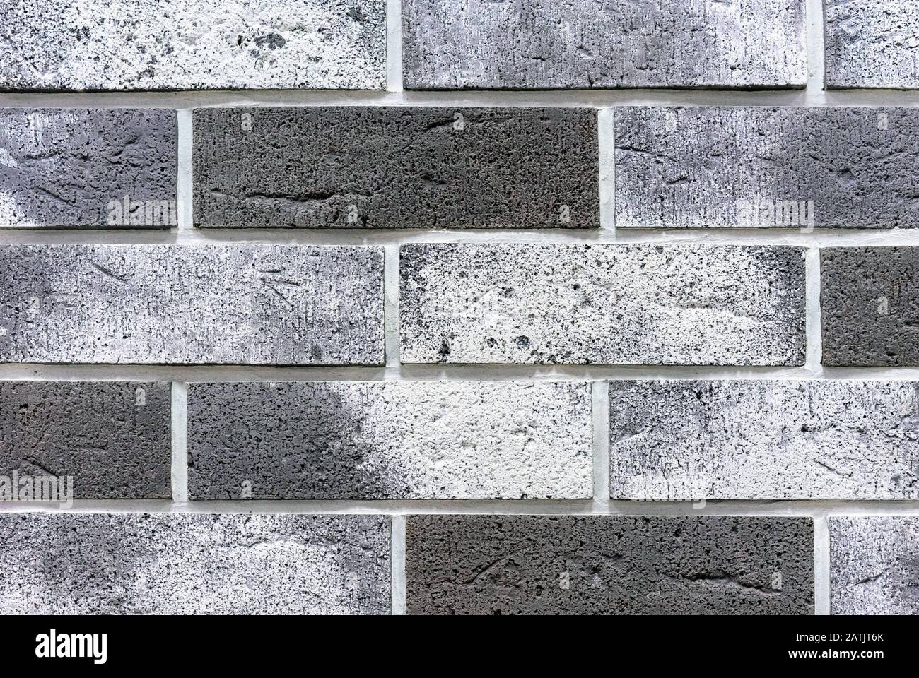 Brick wall from of gray and white bricks. Background and texture of