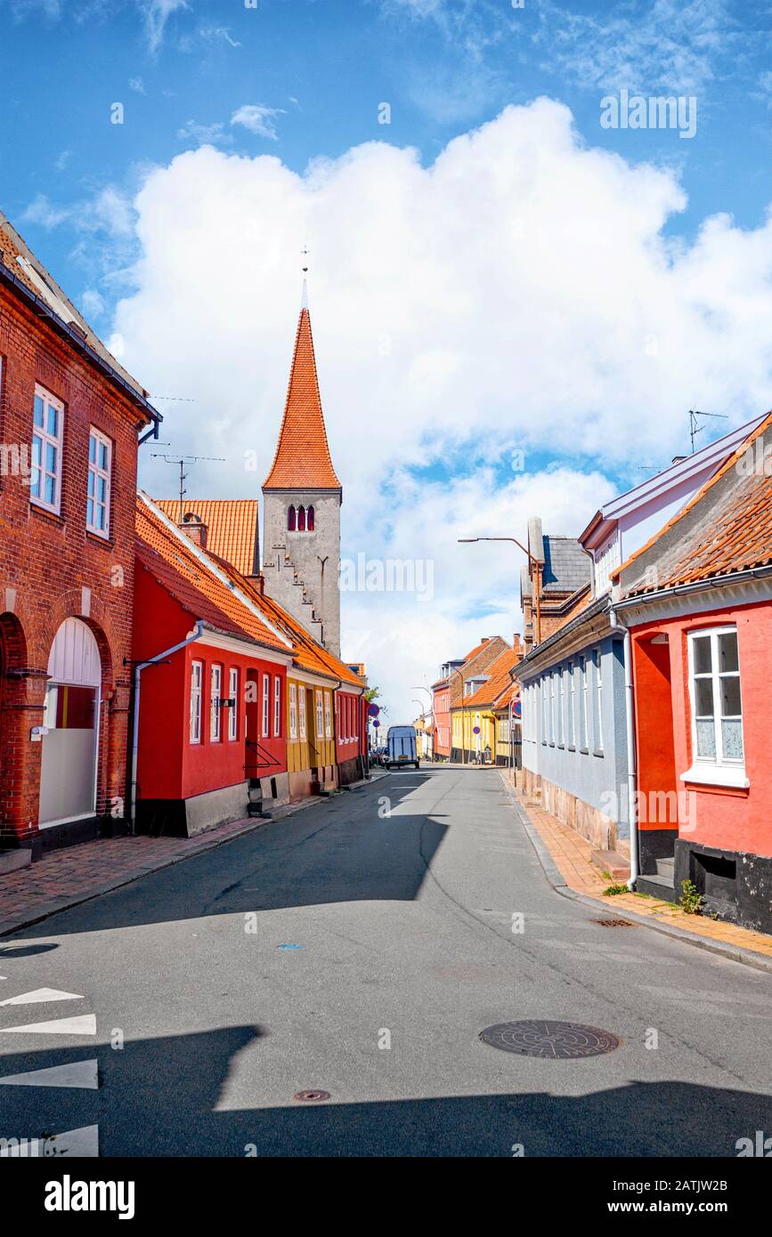 Village with a church in Denmark under a blue sky in the summer Stock Photo
