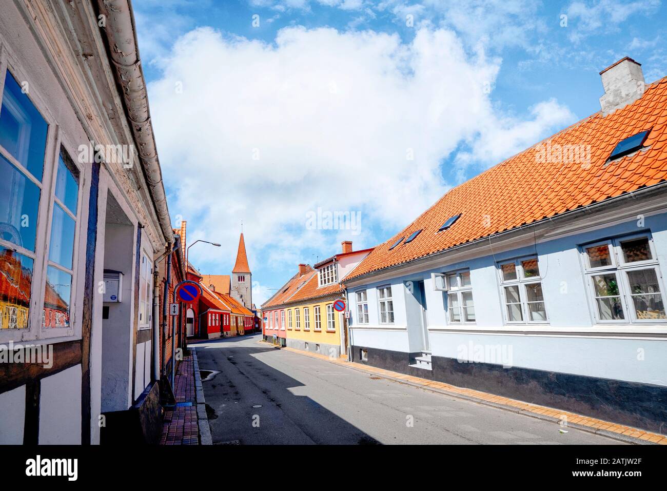 Danish village in the summer with red rooftops under a blue sky Stock Photo