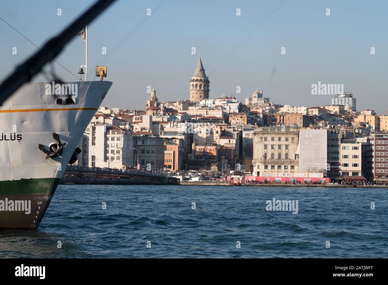 Istanbul, Turkey - Jan 10, 2020: Ferry boat in Golden Horn with Galata Tower in background, Istanbul, Turkey, Europe Stock Photo
