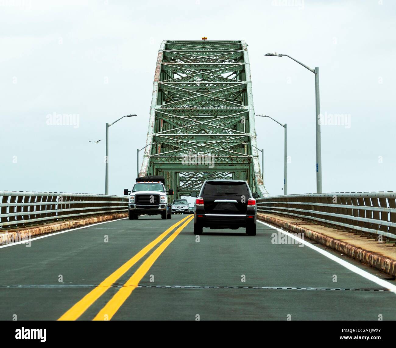 Cars traveling on the Robert Moses bridge going to and from the Fire Island National Sea shore beaches. Stock Photo