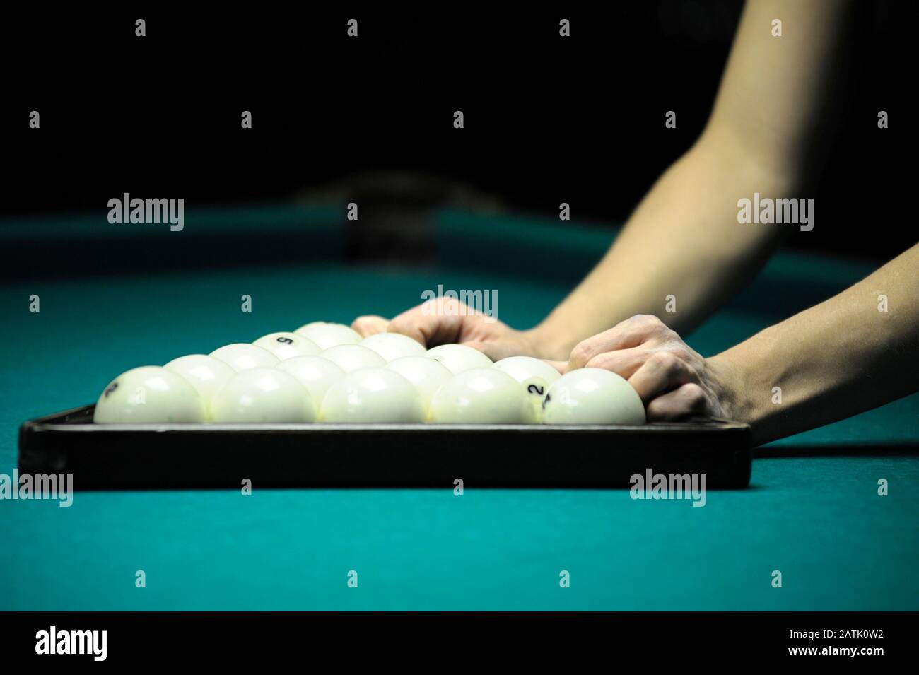 Billiard player hands set the pyramid balls Stock Photo Alamy