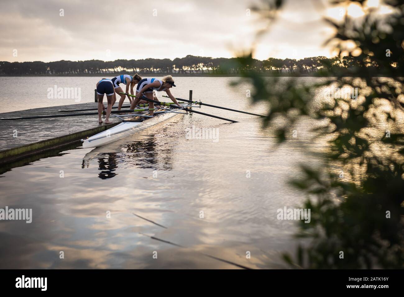 Female rowing team training on a river Stock Photo Alamy