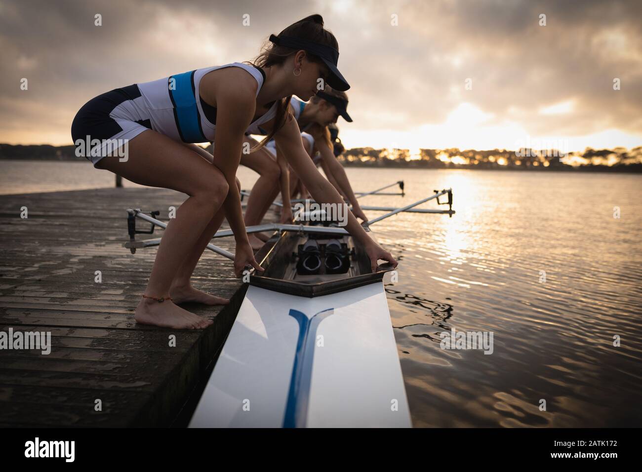 Female rowing team training on a river Stock Photo Alamy