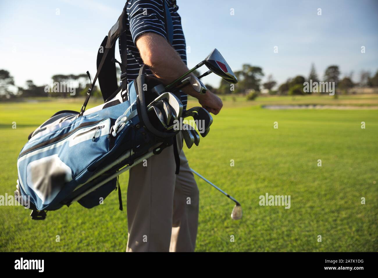 Golfer with golf bag hires stock photography and images Alamy
