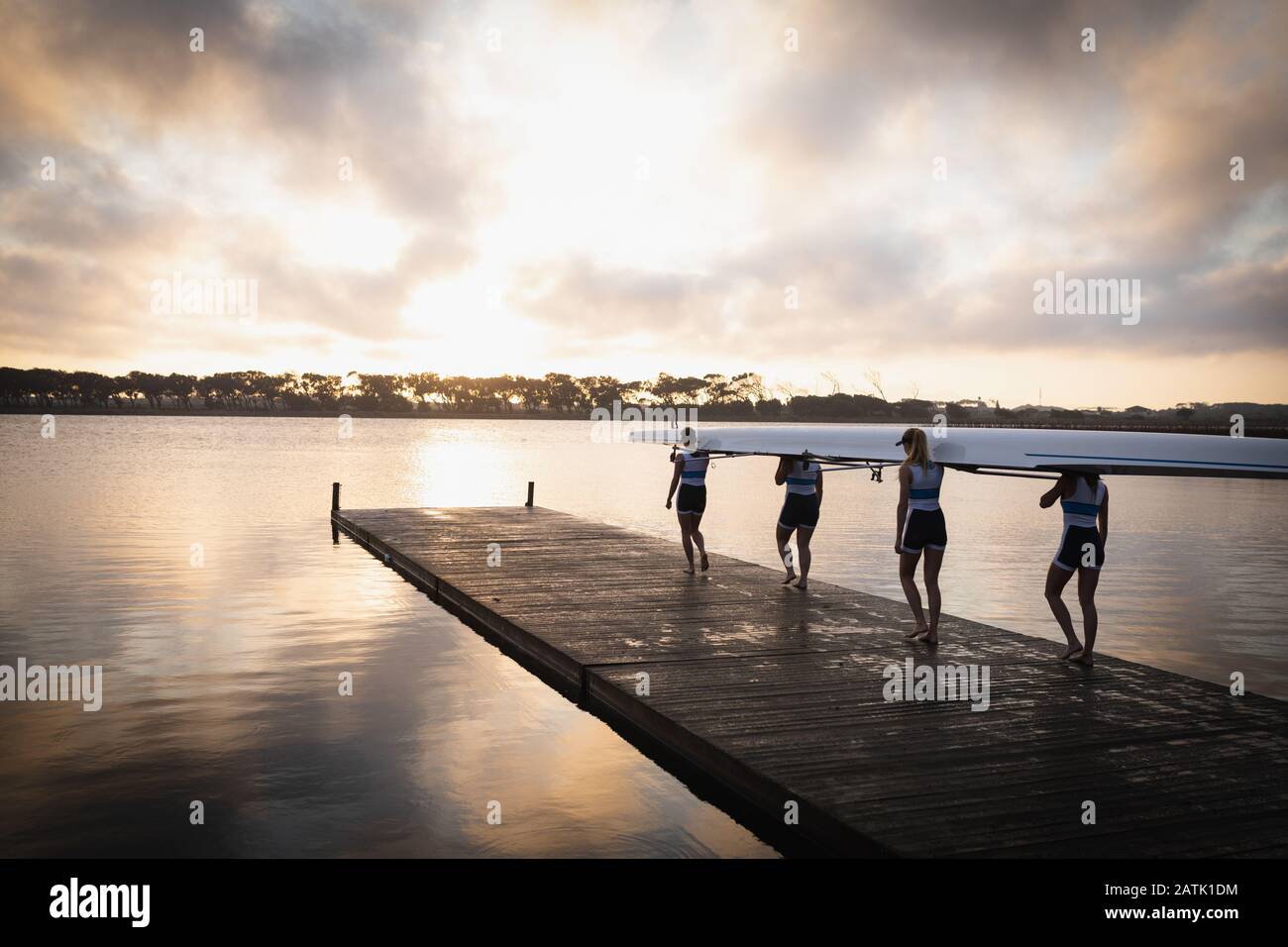 Female rowing team training on a river Stock Photo