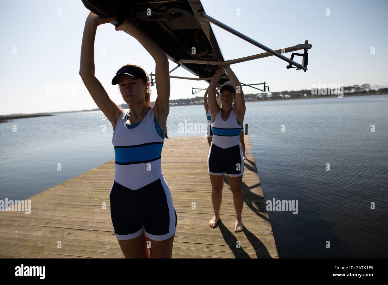 Female rowing team training on a river Stock Photo Alamy