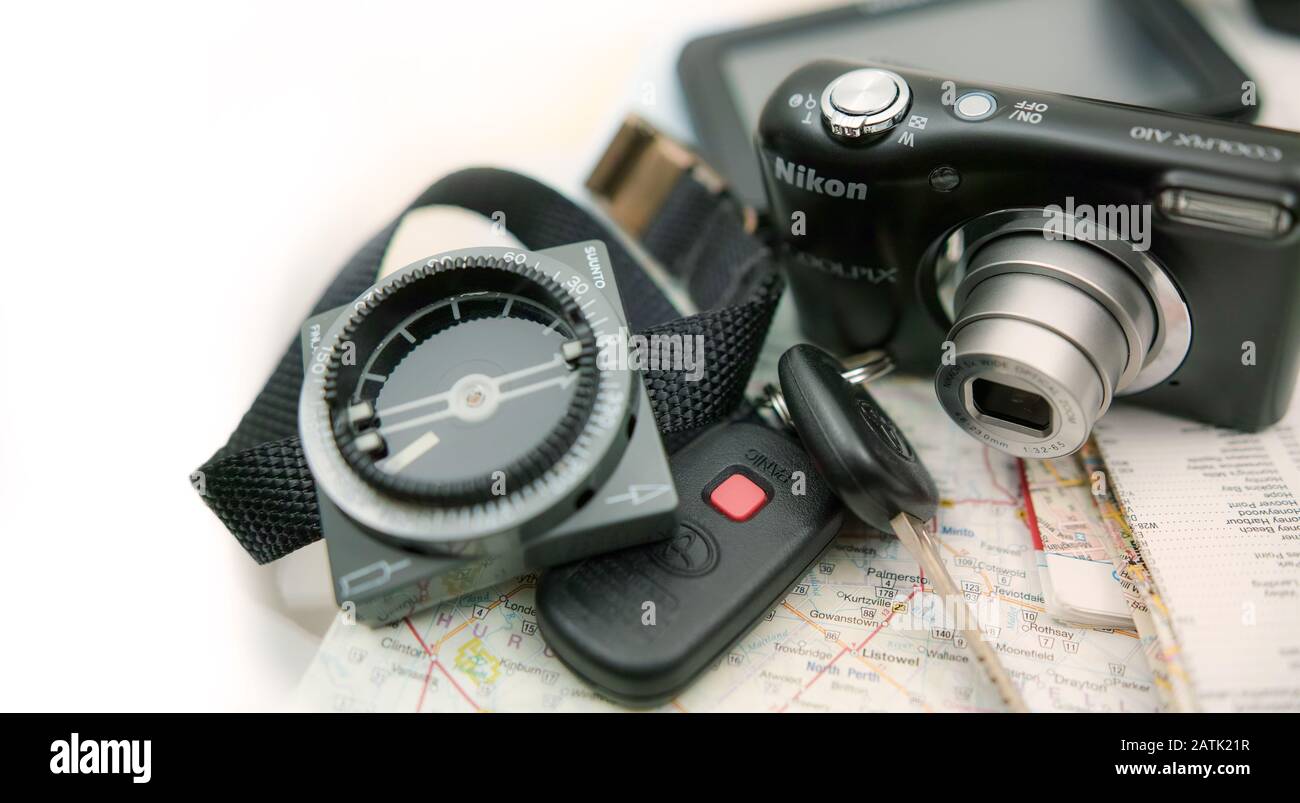 On a map you see compass, camera, car key and GPS. Copy-space Stock Photo -  Alamy