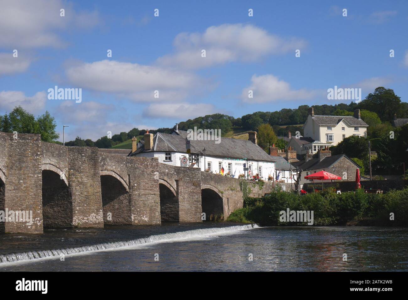 The grade one listed 18th century bridge, standing above a weir, across the River Usk, Crickhowell, Powys, Wales, United Kingdom Stock Photo
