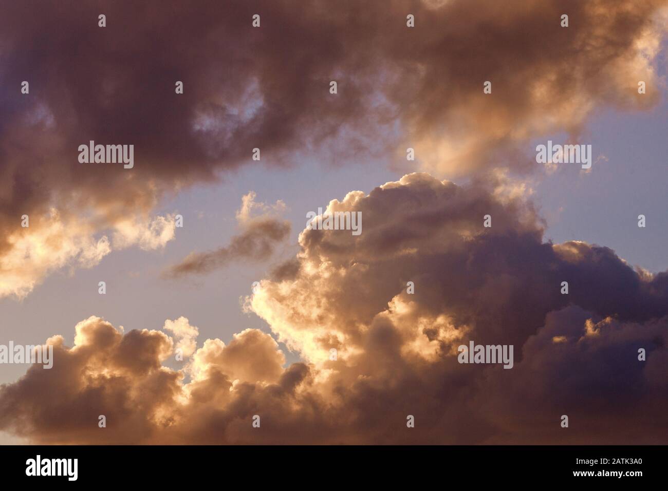 Large clouds in setting sun, backlight. Shades from white to black Stock Photo