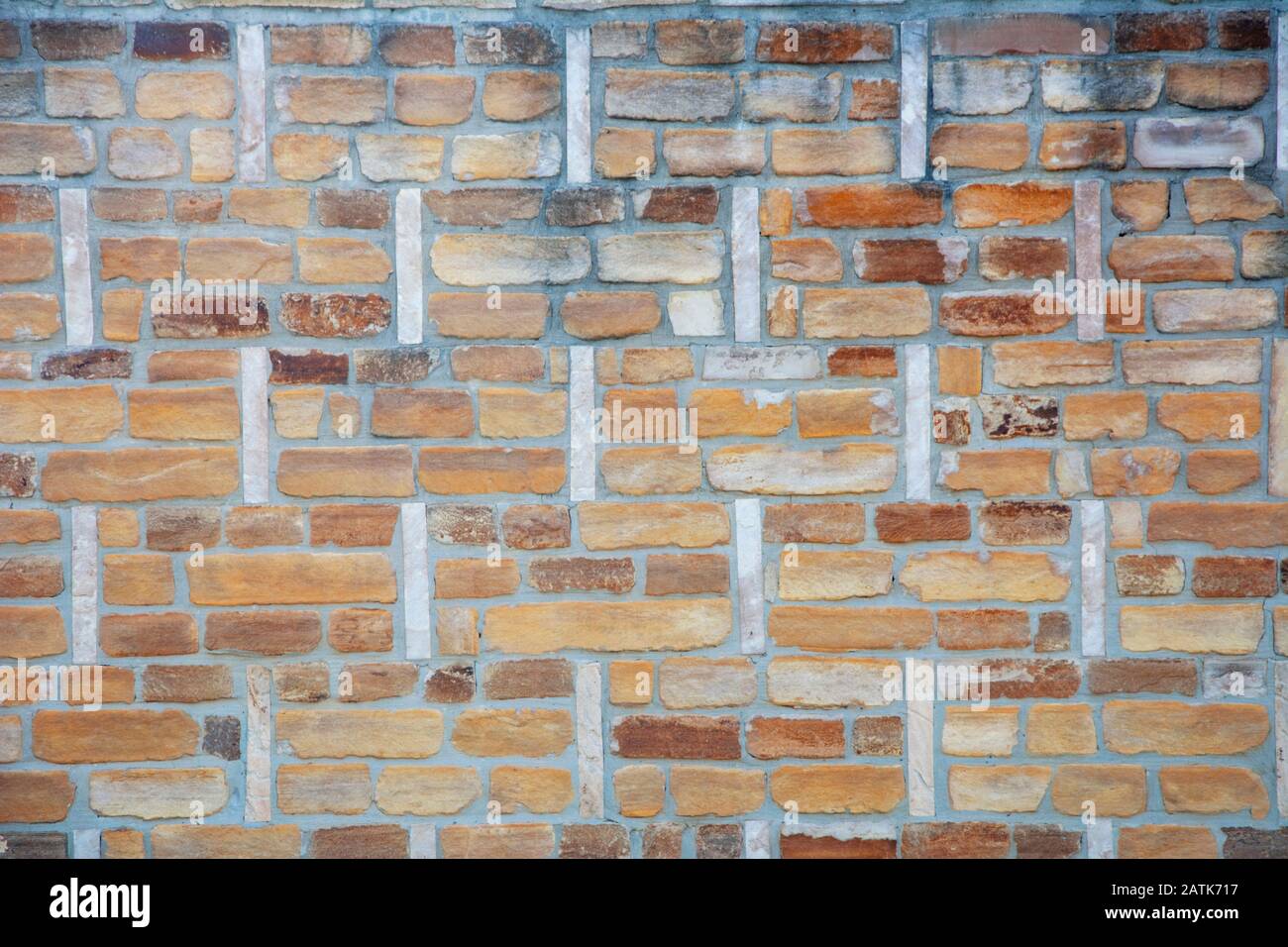 Colorful brick patterned background, limestone wall texture Stock Photo