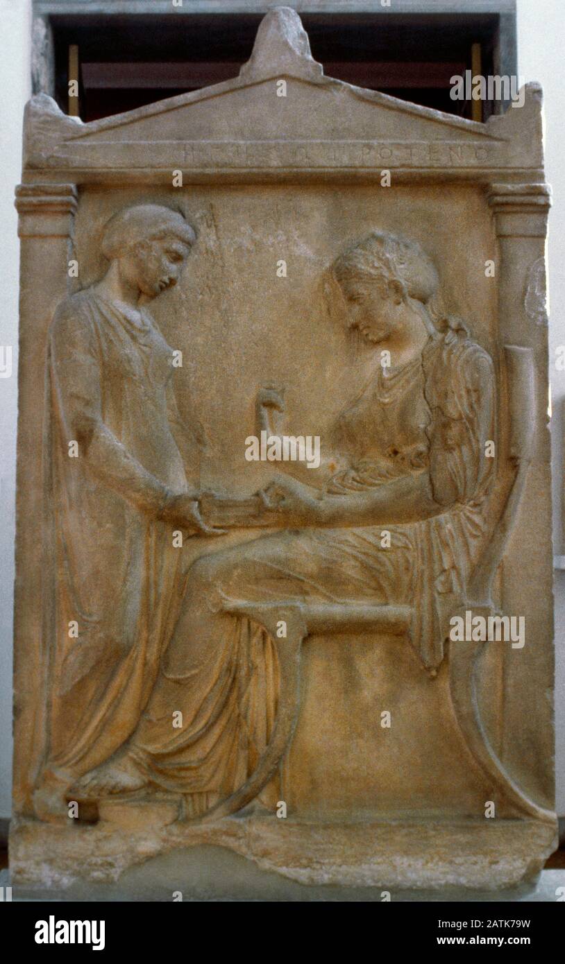 Grave Stele of Hegeso. Relief depicting Hegeso picking a jewel from the open pyxis (jewelry box), seated before her young servant, ca. 410-400 BC. Pentelic marble. From the Kerameikos cemetery, Athens. National Archaeological Museum. Athens, Greece. Stock Photo