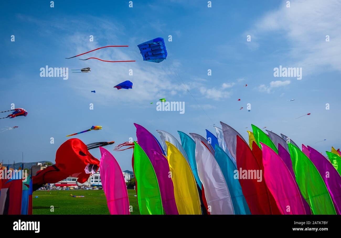 Marseilles, France, Sept 2019, banners for sale and kites in the sky at the “Festival of the Wind” at Seaside Park Prado Stock Photo