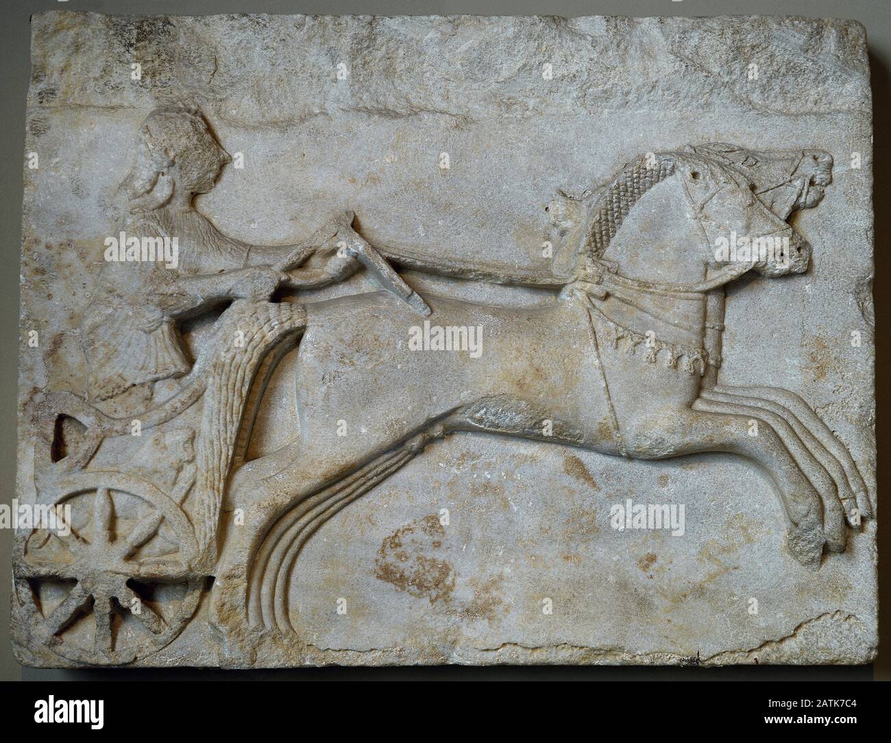 Greek archaic relief depicting a Charioteer. Late 6th century BC. Proconnesian marble. From Cyzicus, Erdek (Turkey). Archaeological Museum. Istanbul. Turkey. Stock Photo