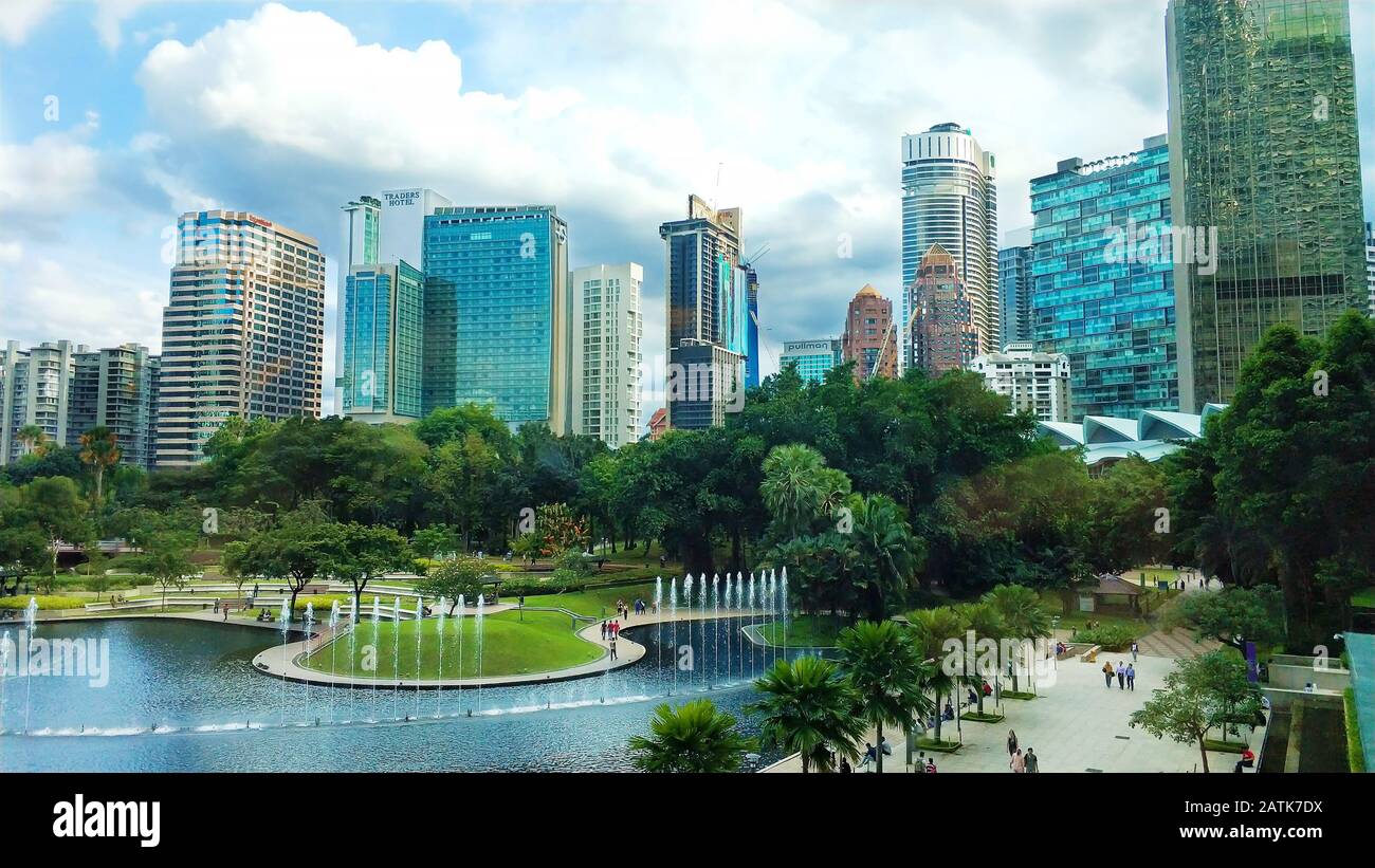 Cityscape of Kuala Lumpur. Beautiful green central park with fountains ...