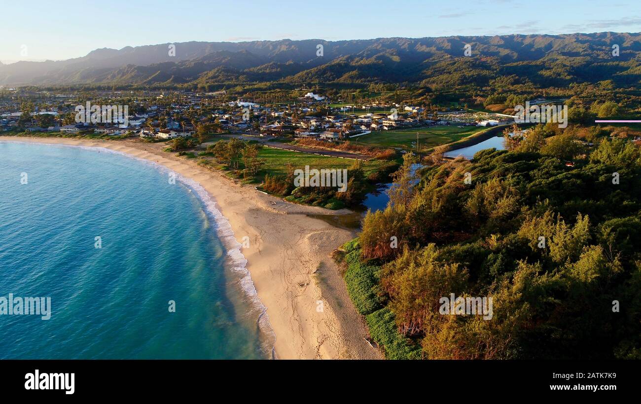 Aerial view down onto Laie Beach Park (Pounders) with calm turquoise