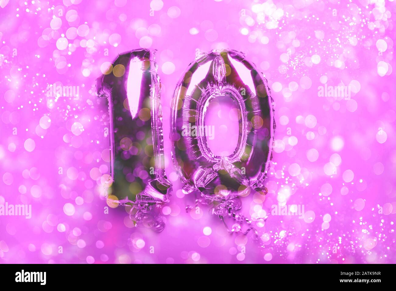 Silver Number Balloons 10 On Pink Background With Bokeh Lights