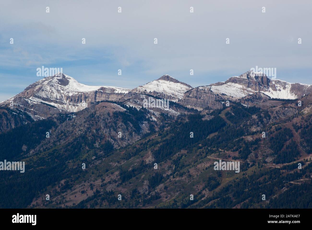 Snow Capped Mountain with clouds Stock Photo - Alamy