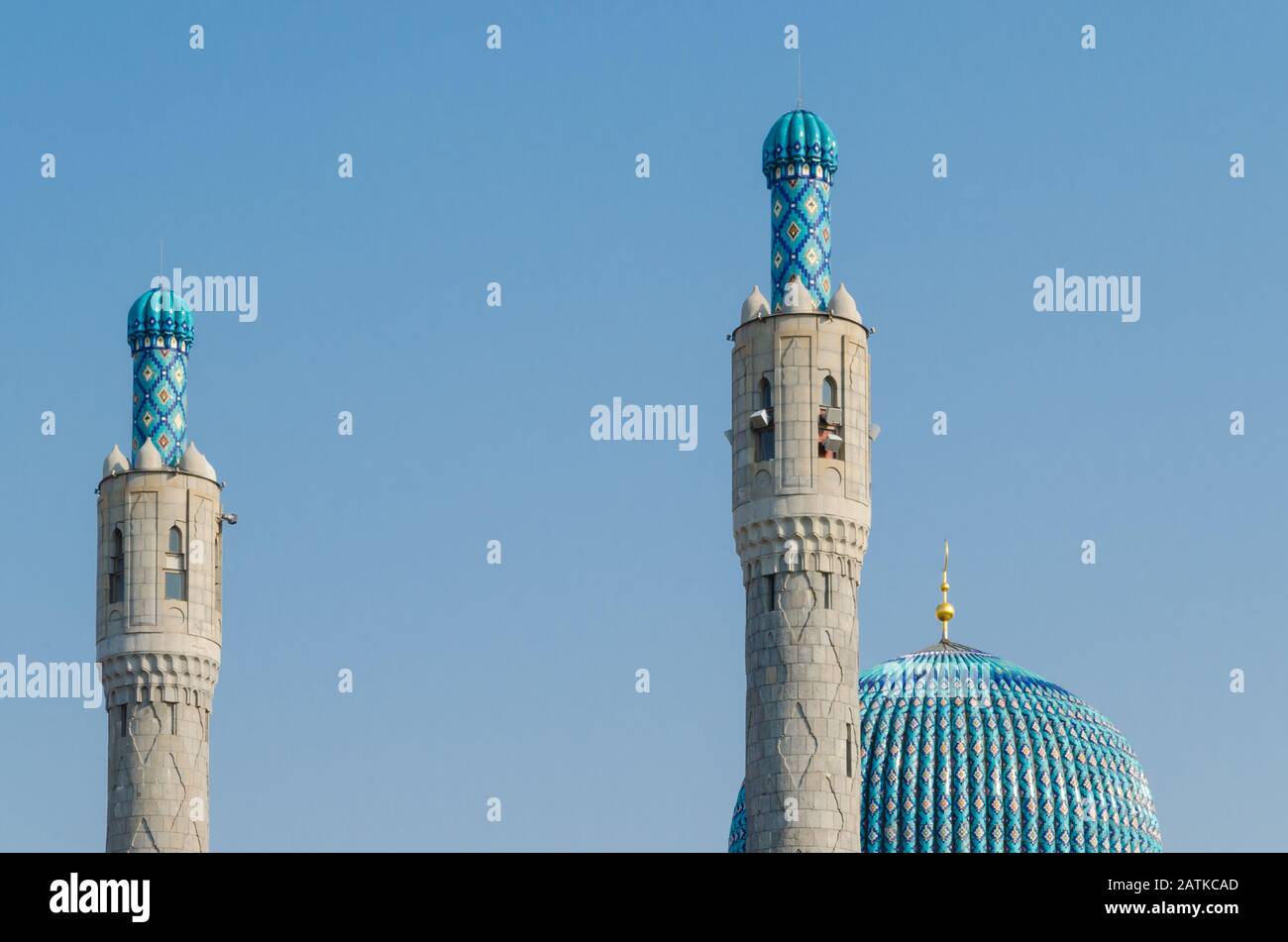 The magnificent dome and minarets of the cathedral mosque against the blue sky. Ramadan Kareem background. Stock Photo