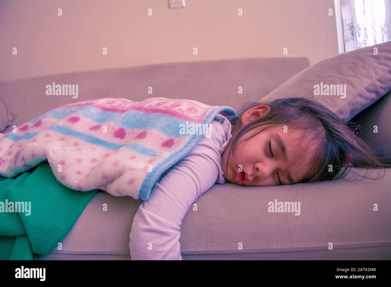 3 year old little girl sleeping on sofa Stock Photo