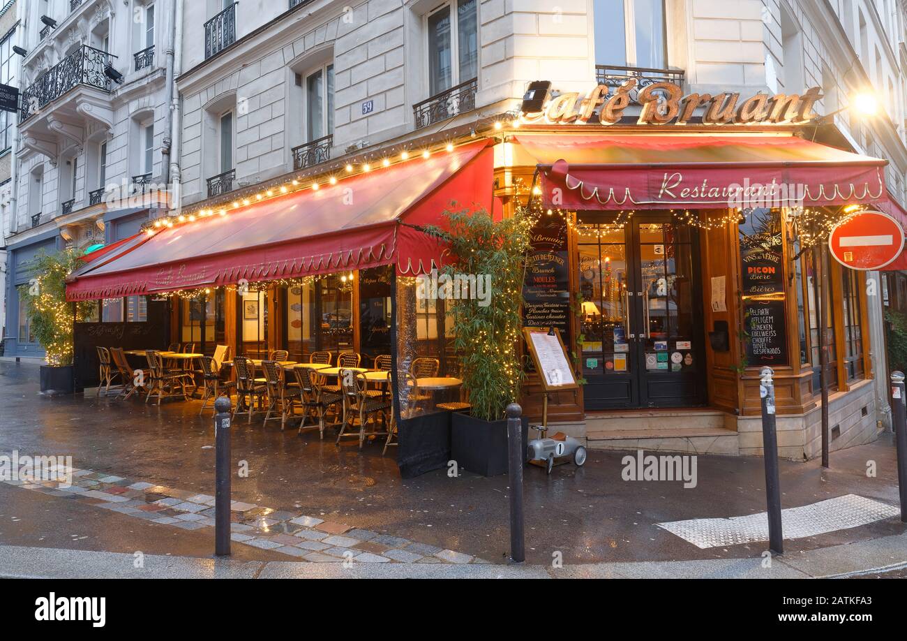 Cafe Bruant at rainy morning . It is a traditional French restaurant in the Montmartre district, Paris, France. Stock Photo