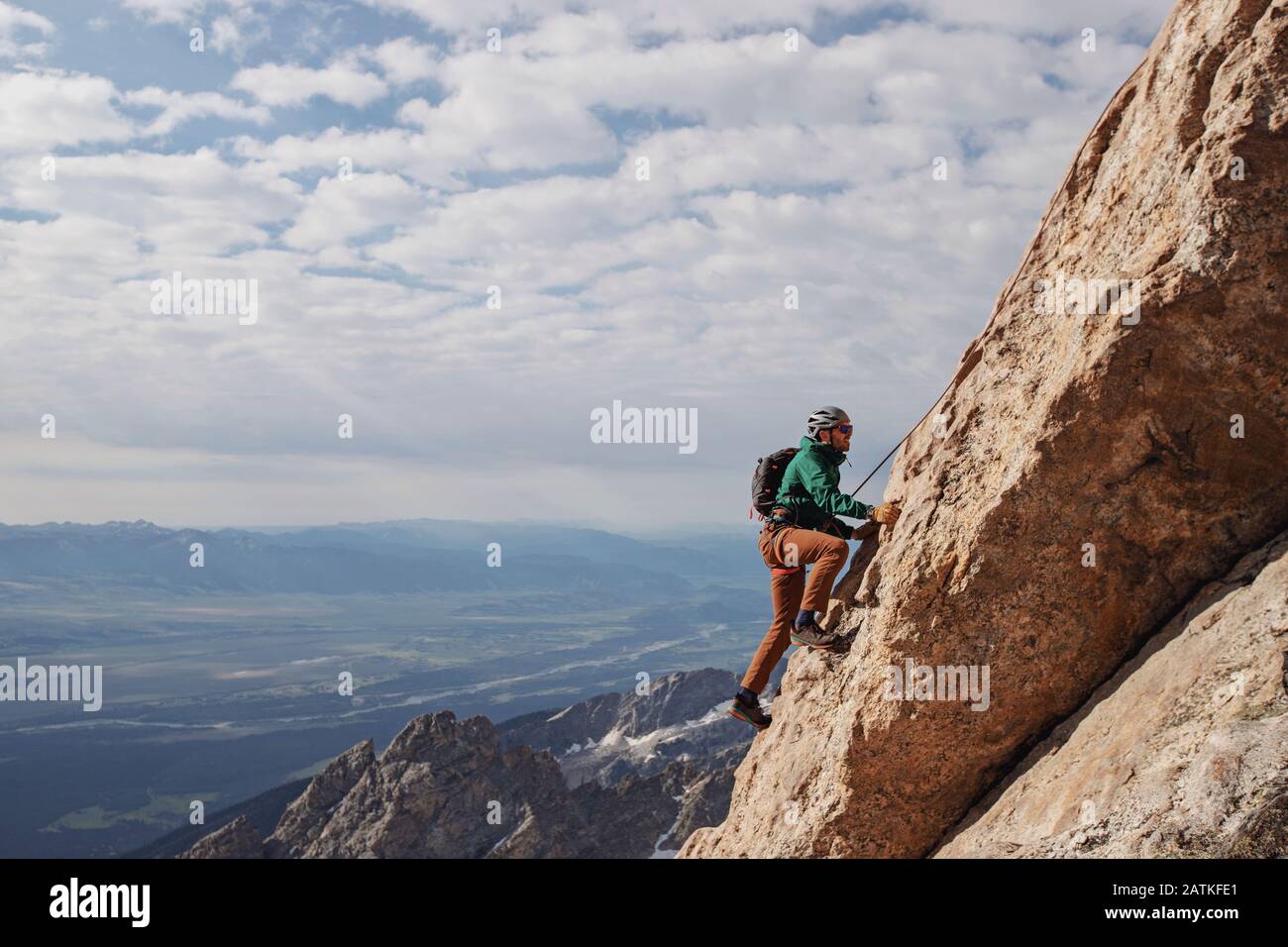 Male rock climber ascends the Exum Ridge route on the Grand Teton. Stock Photo