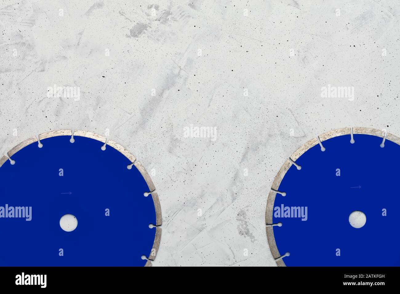 Diamond cutting discs on a background of gray concrete Stock Photo - Alamy