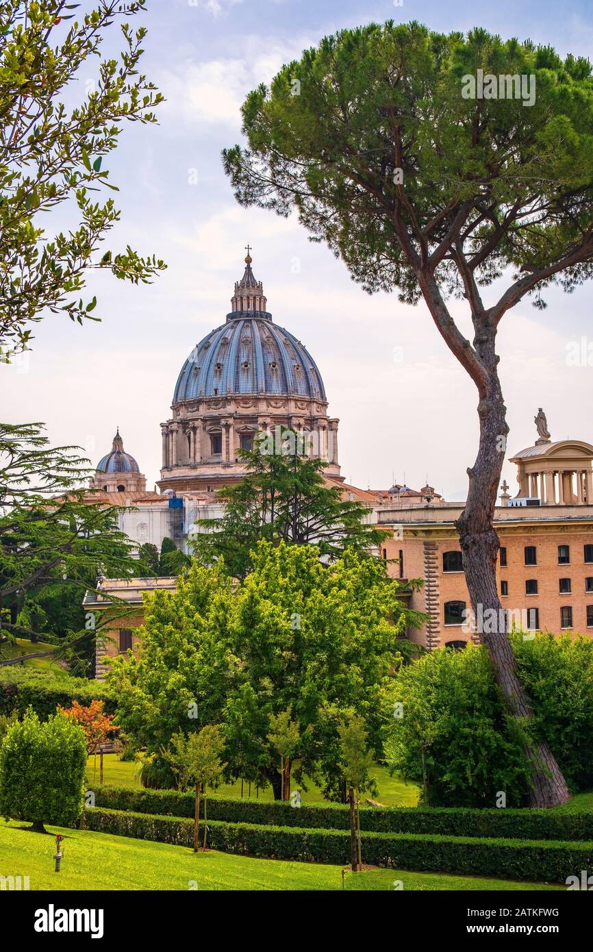 Rome, Vatican City / Italy - 2019/06/15: Panoramic view of St. Peter’s Basilica - Basilica di San Pietro in Vaticano - dome by Michelangelo Buonarotti Stock Photo
