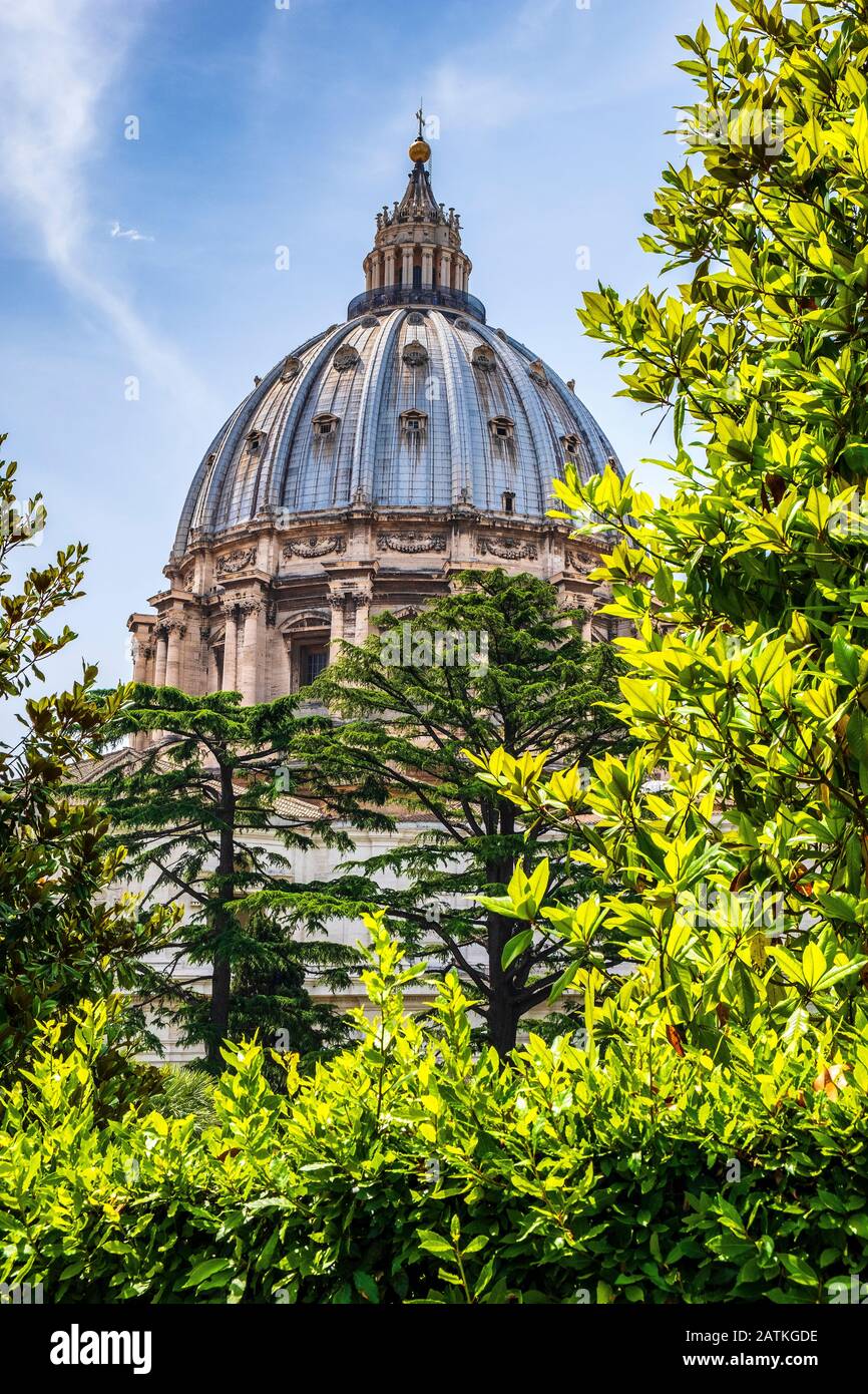Rome, Vatican City / Italy - 2019/06/15: Panoramic view of St. Peter’s Basilica - Basilica di San Pietro in Vaticano - dome by Michelangelo Buonarotti Stock Photo