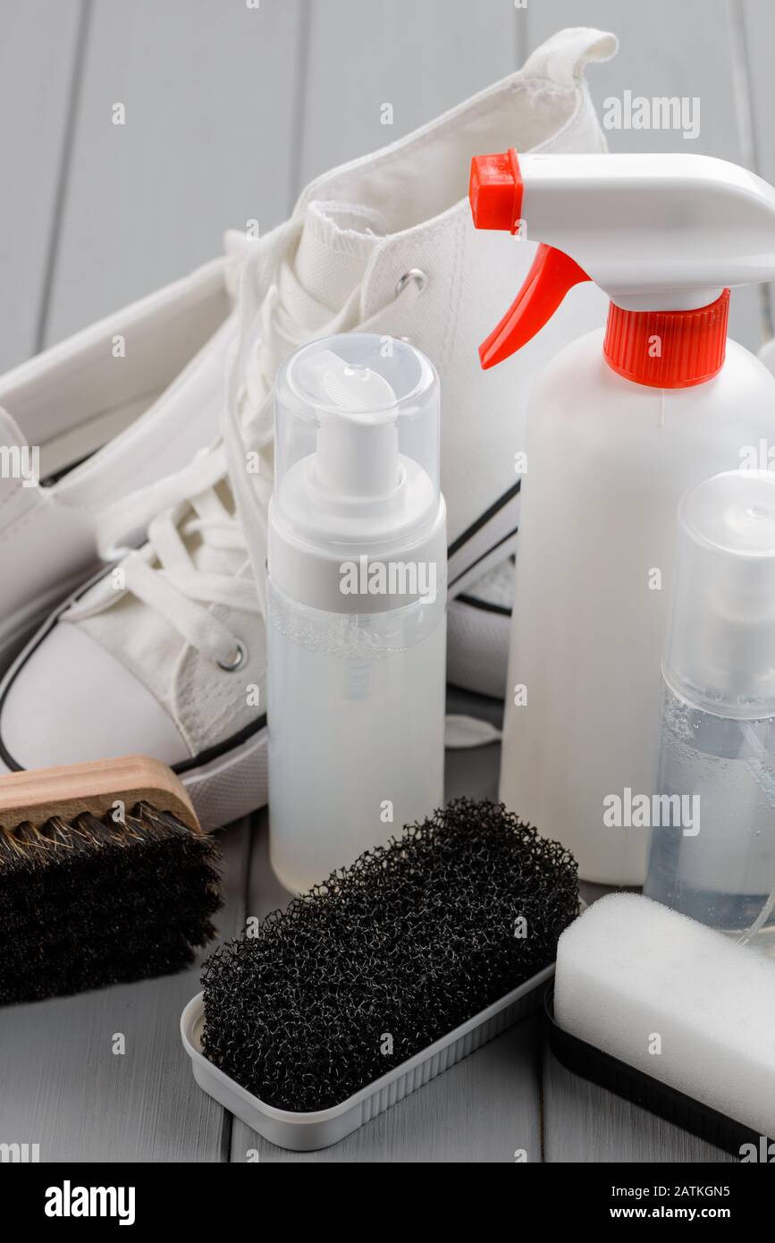White footwear cleaning products and tools on gray Stock Photo