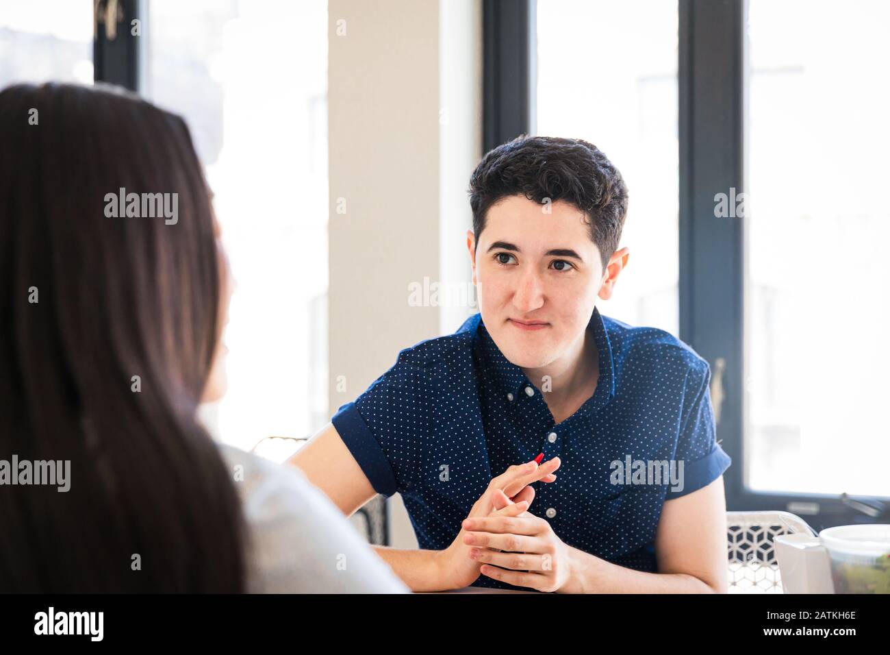 businessman discussing with female coworker in office Stock Photo