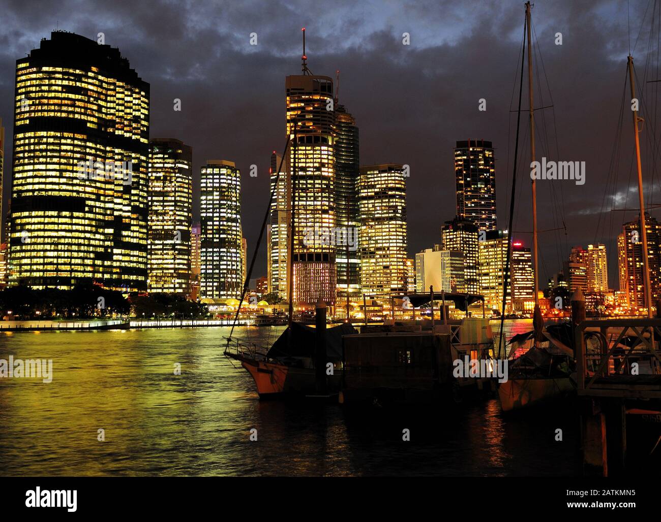 View From Kangaroo Point To The Brightly Illuminated Skyline Of Brisbane At Night Queensland Australia Stock Photo