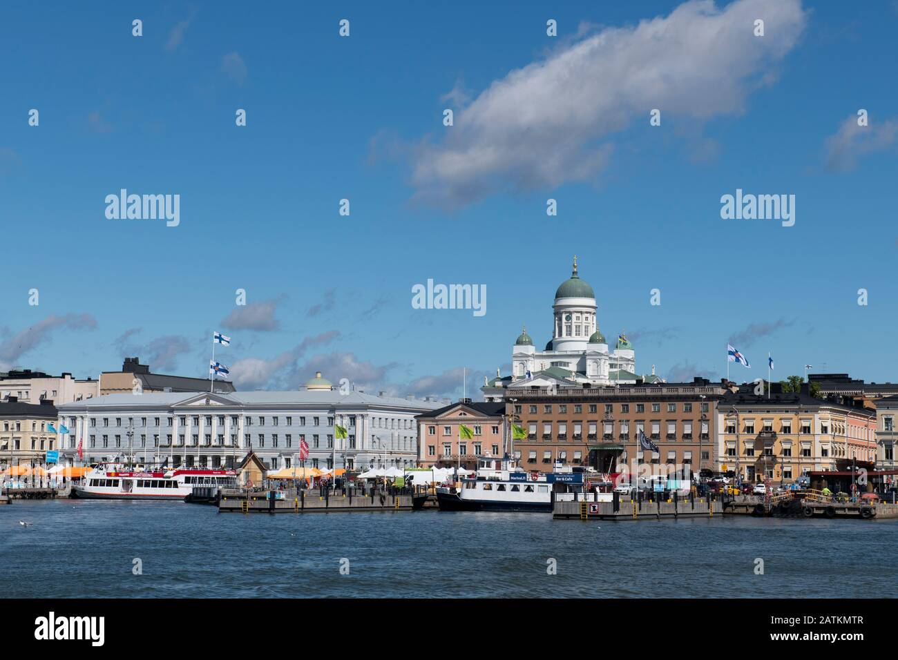 Finland, capital city of Helsinki. South Harbour pier and waterfront area with Market Square. Sightseeing boats in harbor. Stock Photo