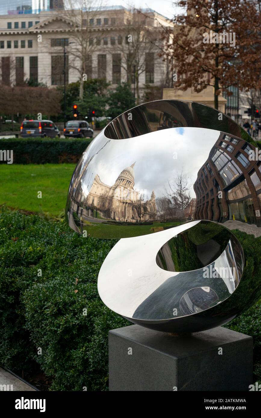 Polished stainless steel modern sculpture as public art in Carter Lane