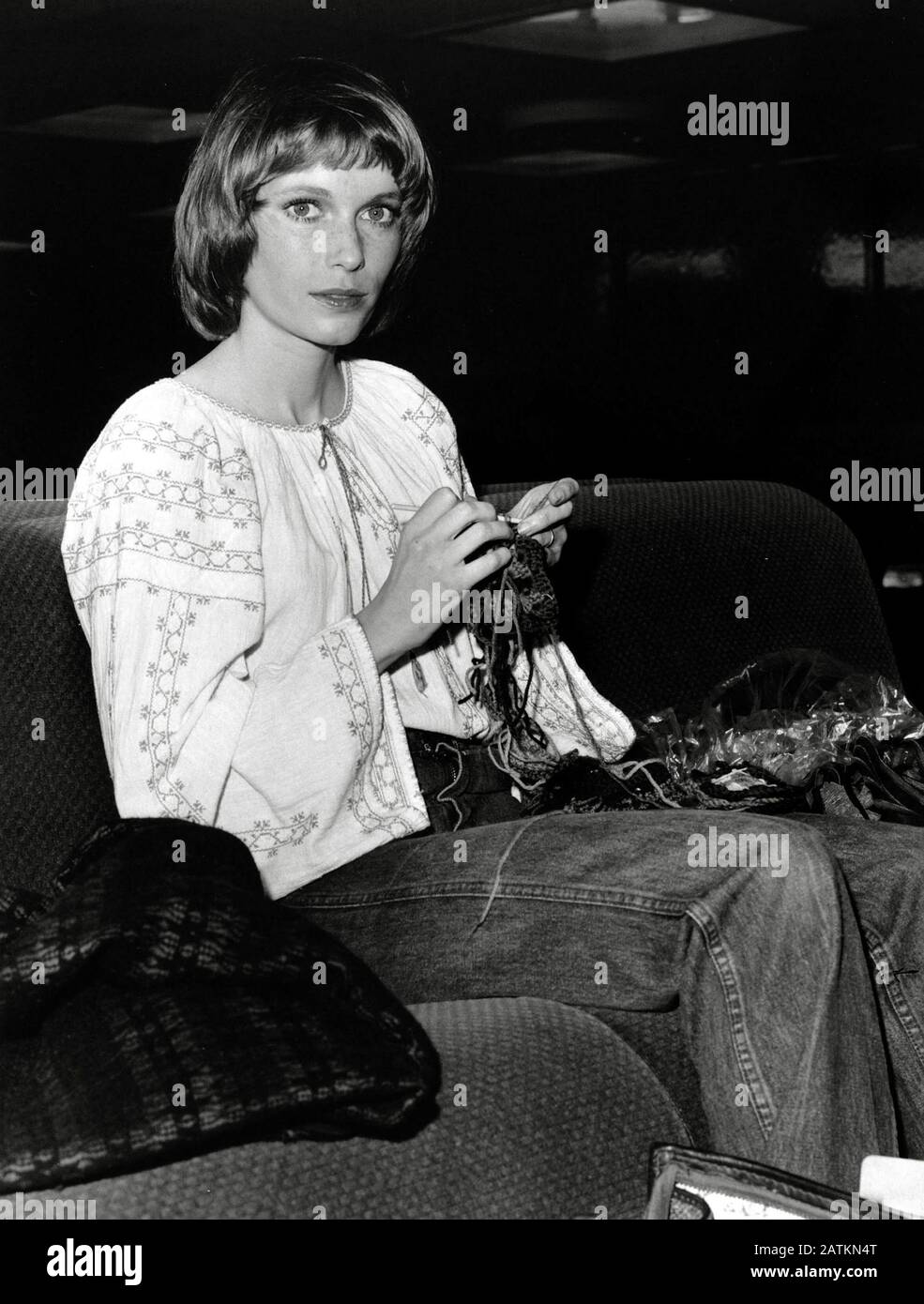Mia Farrow knitting at Heathrow Airport (1971) Cinema Legacy Collection