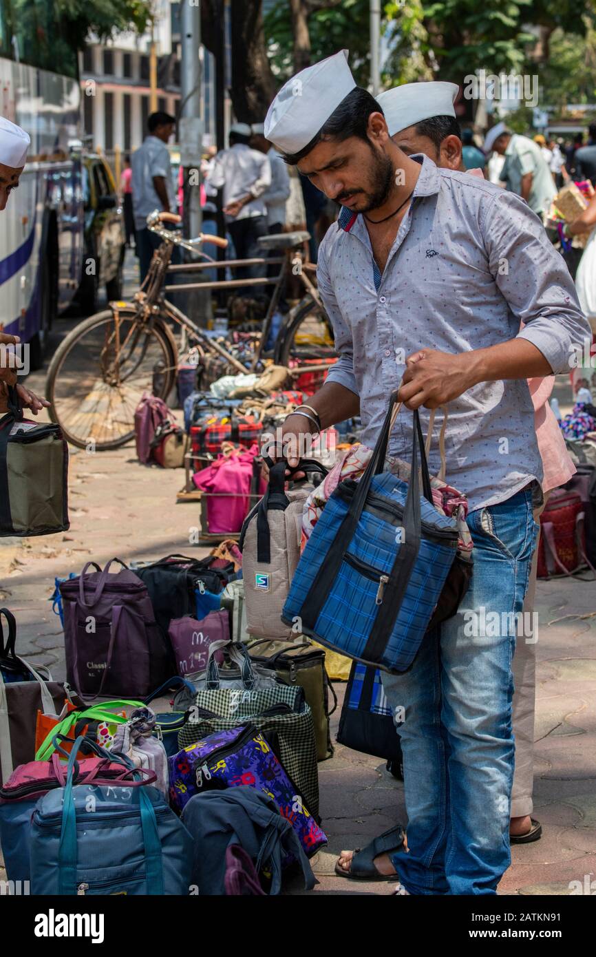 India, state of Maharashtra, capital city of Mumbai aka Bombay. Dabbawalas (aka dabbawallas or dabbawallahs, tiffin wallahs) deliver lunches all over Stock Photo