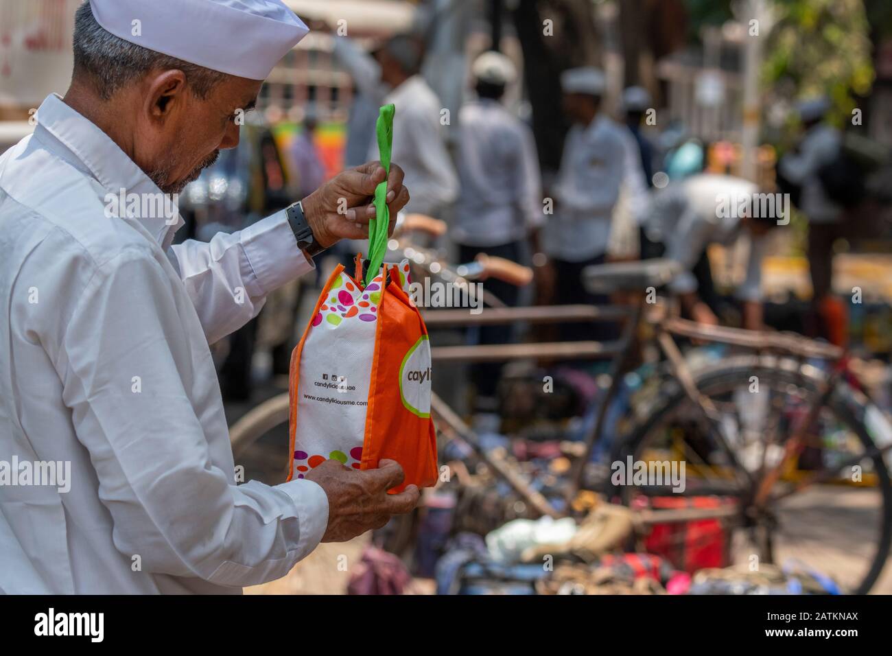 India, state of Maharashtra, capital city of Mumbai aka Bombay. Dabbawalas (aka dabbawallas or dabbawallahs, tiffin wallahs) deliver lunches all over Stock Photo