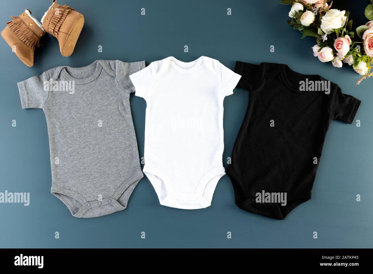 Download Three Baby Bodysuits On A Blue Background Mockup 3 Baby Grows Flat Lay White Grey Black Stock Photo Alamy