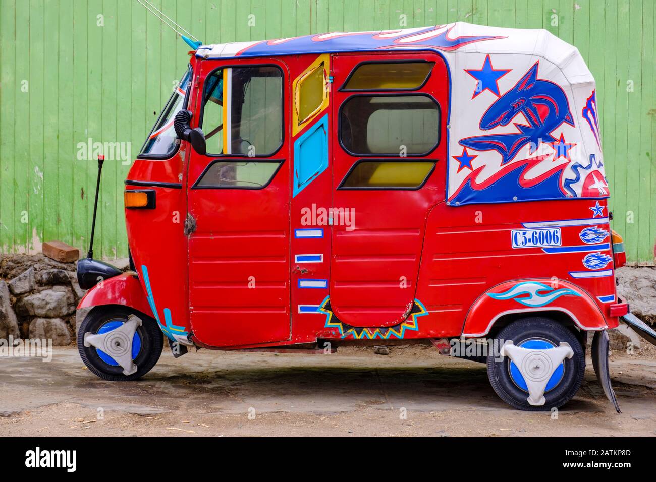 Side view of a parked red Peruvian tuk-tuk, auto rickshaw, Peru Stock Photo