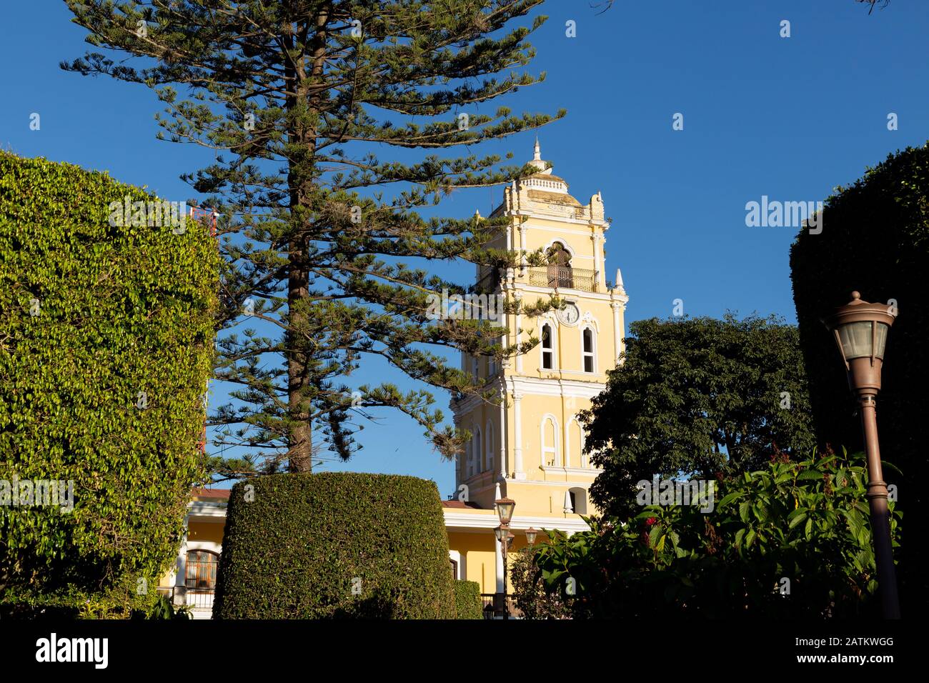 Huehuetenango Central Park with clock tower surrounded by trees Latin American peoples Stock Photo