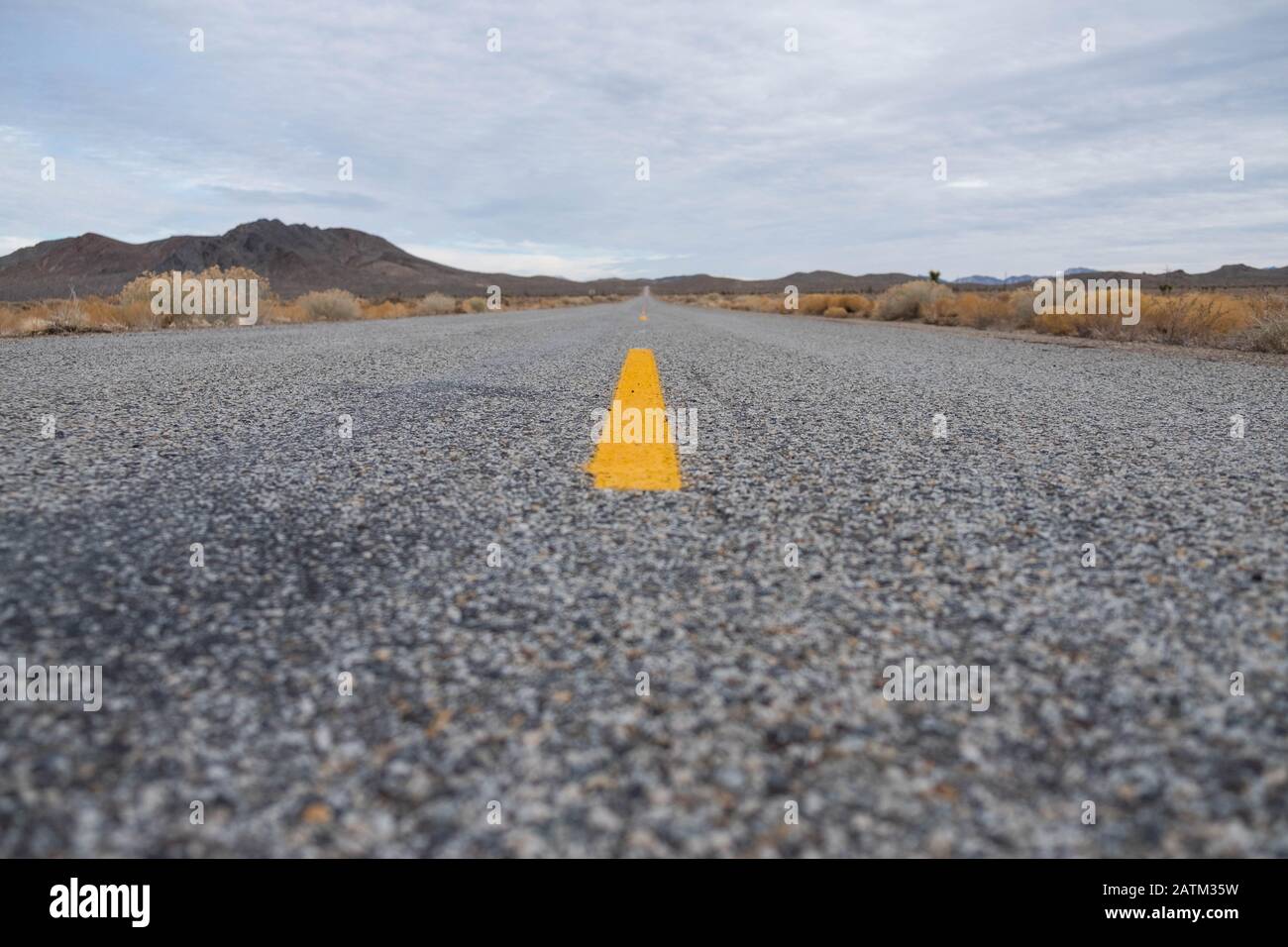open road. no car. yellow strip. cloudy day Stock Photo