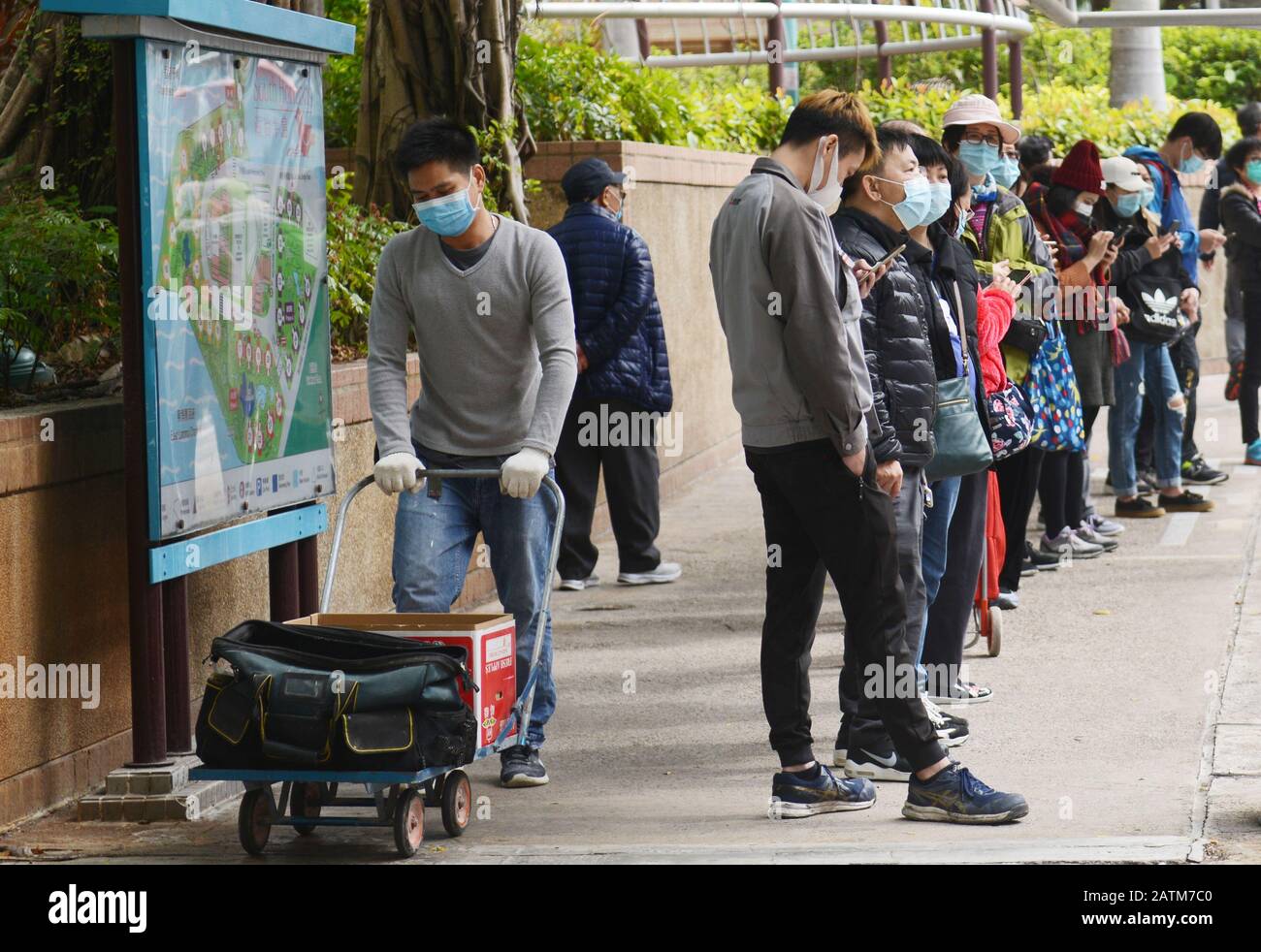 Local Hong Kongers wearing surgical masks during the Wuhan Coronavirus epidemic. Stock Photo