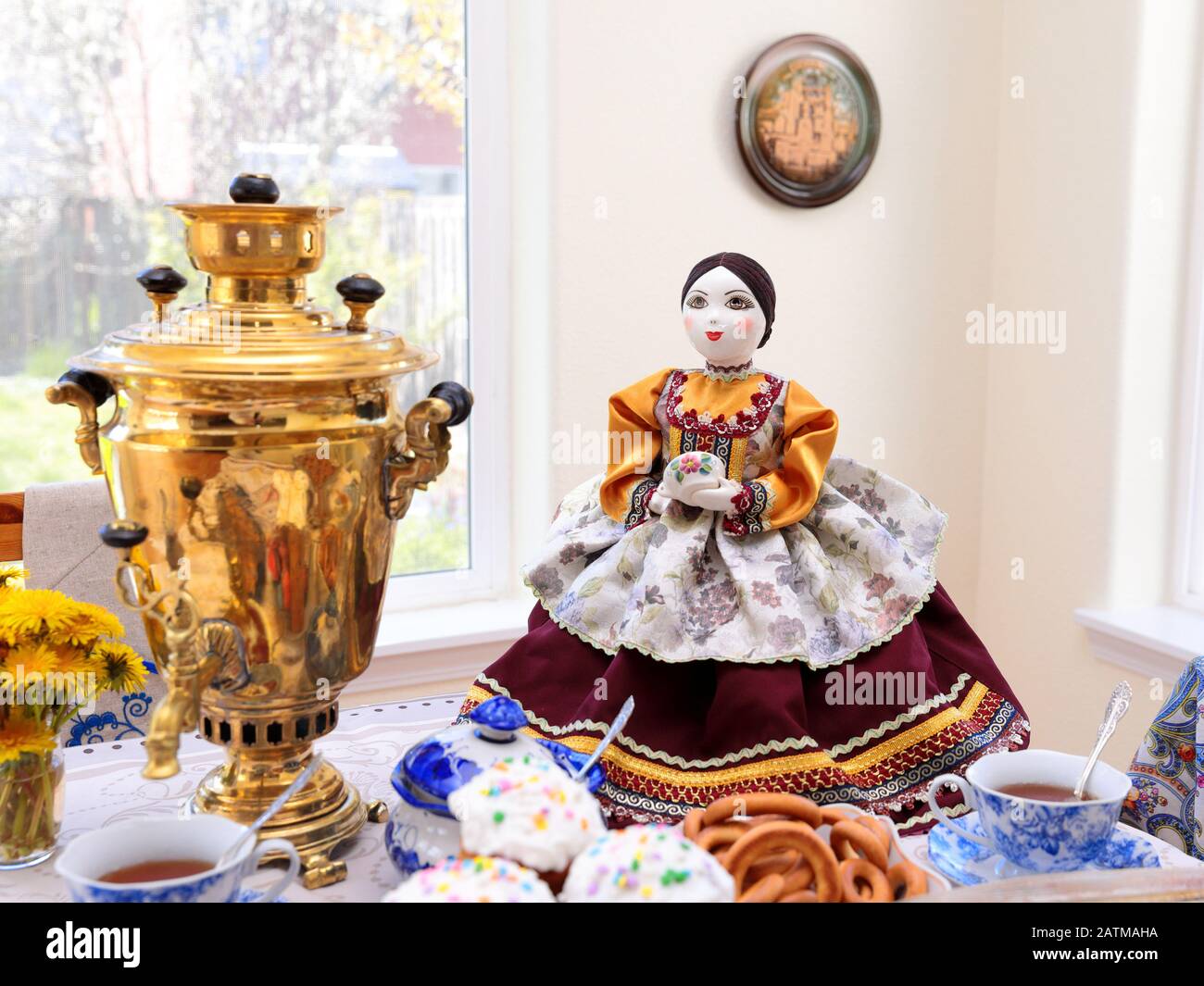 Hillsboro, OR  USA - 15 April 2017: A large decorative tea warmer in a form of a doll in traditional Russia dress holding teacup standing next to a Stock Photo