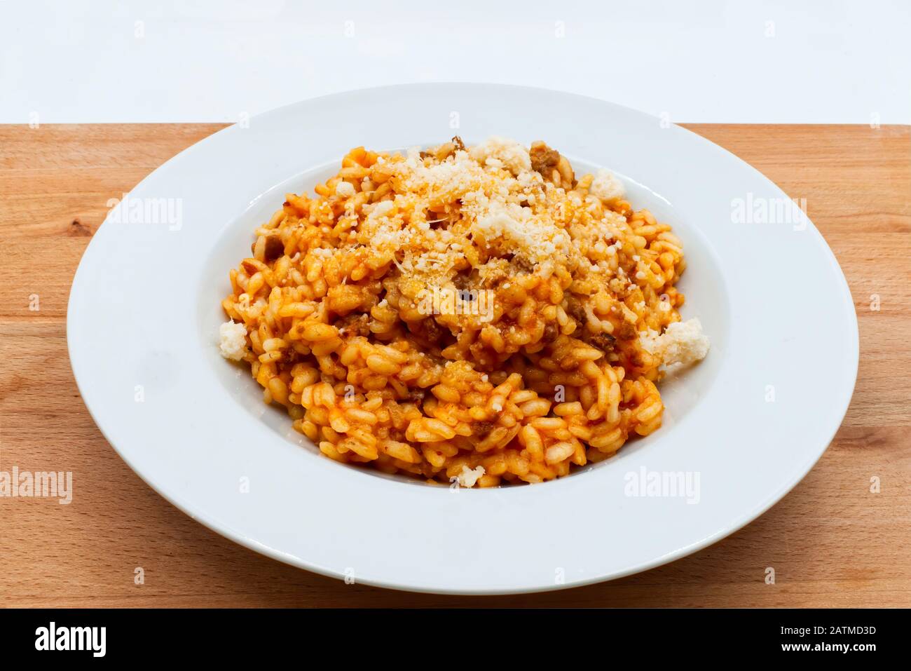 Traditional italian risotto with bolognese ragu and parmigiano reggiano cheese Stock Photo